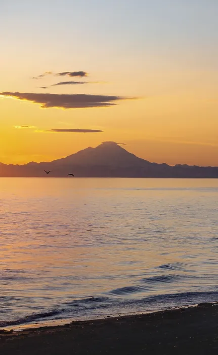 Framed Print : View of Cook Inlet on white mountain peaks of Mount Redoubt at sunset Framed Print : View of Cook Inlet on white mountain peaks of Mount Redoubt at sunset