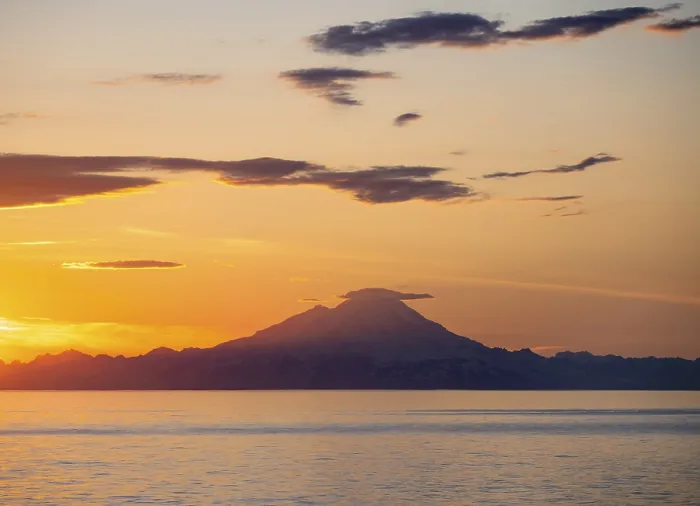 Framed Print : View of Cook Inlet on white mountain peaks of Mount Redoubt at sunset