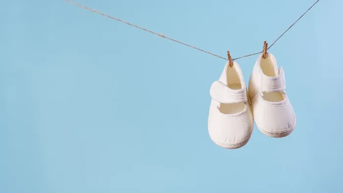 Framed Print : Front view cute little baby shoes with copy space