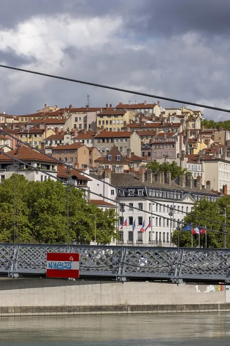 Framed Print : View of densely built houses through Passerelle du College