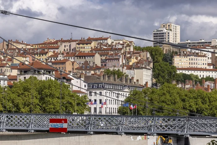 Framed Print : View of densely built houses through Passerelle du College