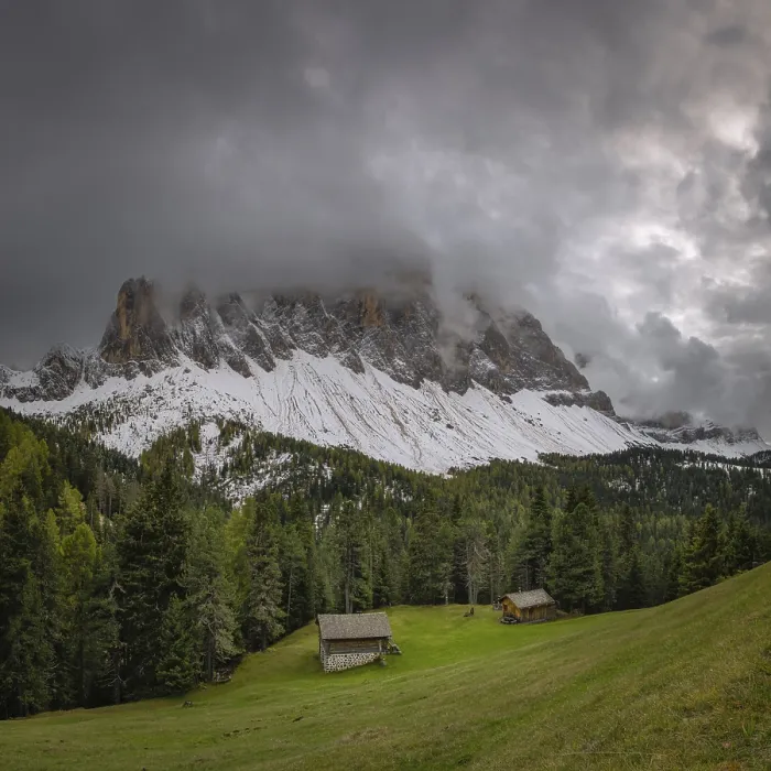 Framed Print : View of a part of the Geisler group in the foreground two mountain huts Framed Print : View of a part of the Geisler group in the foreground two mountain huts