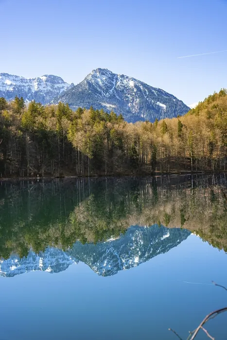 Framed Print : View over the green lake with mountain in the background
