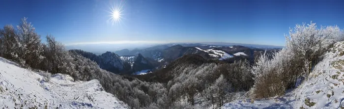 Framed Print : View over the hills and valleys from the mountain with hoarfrost on the branches in winter