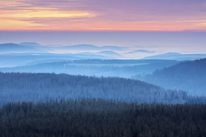 Framed Print : View over hilly landscape with valley fog at sunset Framed Print : View over hilly landscape with valley fog at sunset