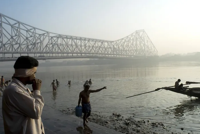 Framed Print : View of Howrah Bridge (Rabindra Setu) from Ghat On The River Hooghly A miracle of engineering skill