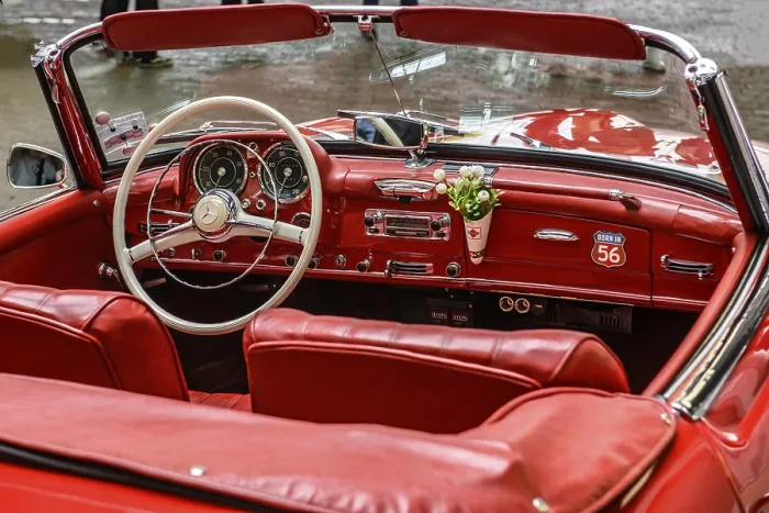 Framed Print : View into interior of convertible classic car Mercedes SL 190 with red leather