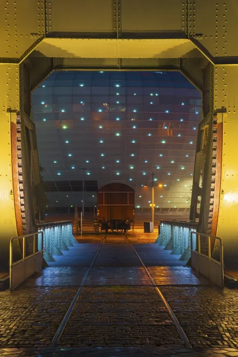 Framed Print : View of the Klimahaus in Bremerhaven at night through a historic bascule bridge