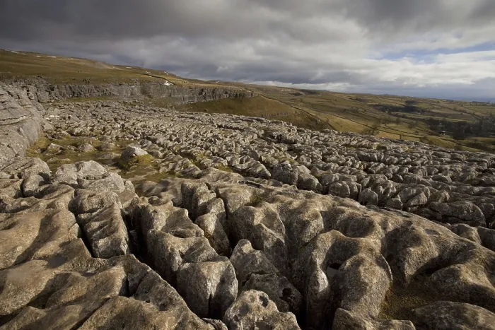 Framed Print : View of limestone pavement in upland landscape