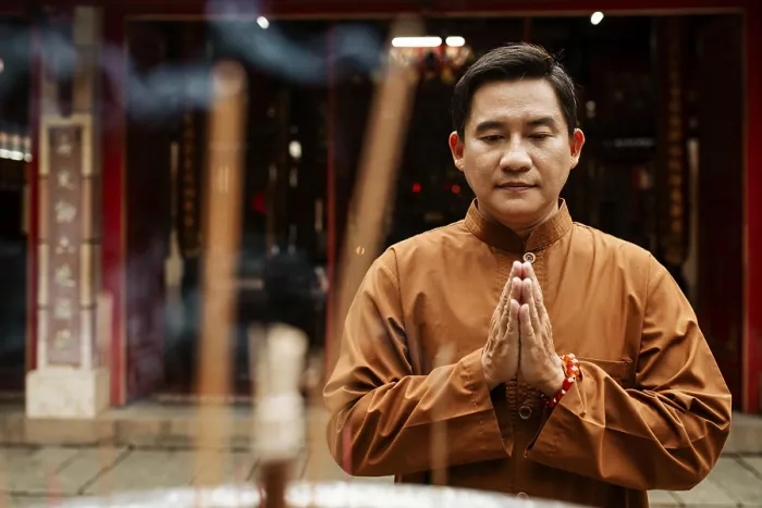 Framed Print : Front view man praying temple with incense