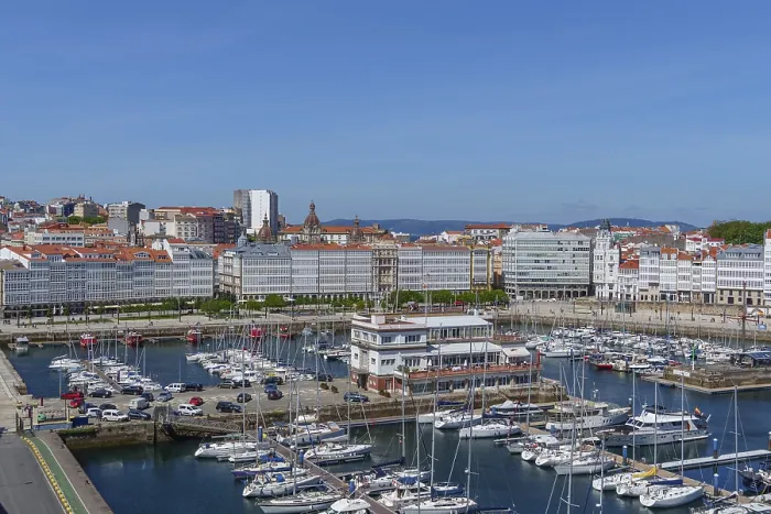 Framed Print : View of marina with numerous boats and modern white buildings