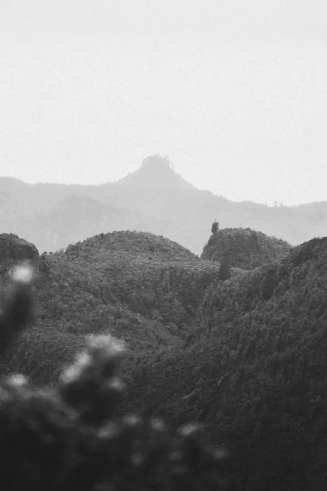 Framed Print : View of misty hills and mountains in black and white