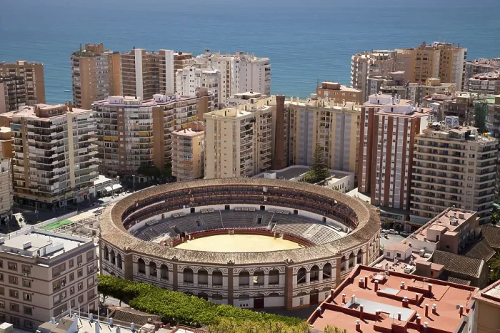 Framed Print : View from Monte de Gibralfaro over a bullring surrounded by skyscrapers