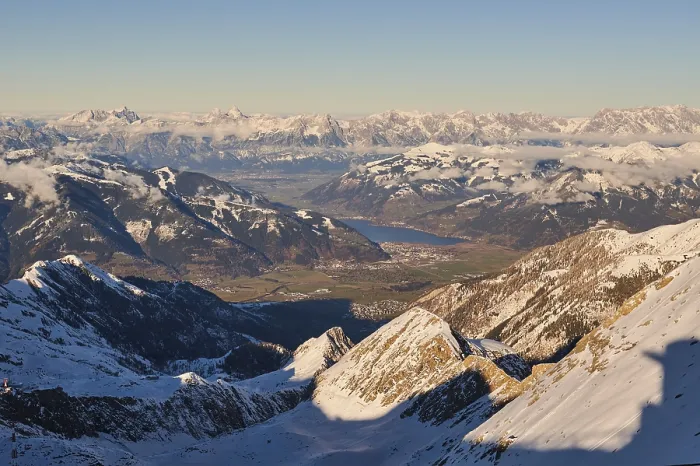 Framed Print : View from Mount Kitzsteinhorn on snow covered mountains down to Zell am See