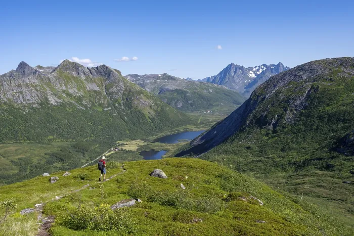 Framed Print : View of mountain landscape, mountaineer on hiking trail to the summit of Rundfjellet