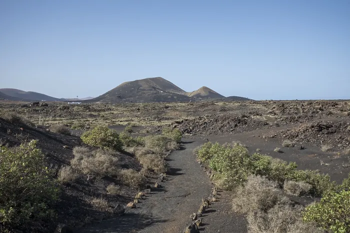 Framed Print : View of mountain range with volcanoes in Timanfaya National Park