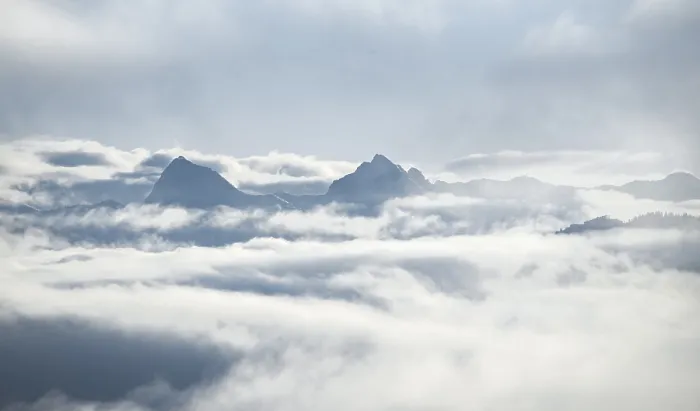 Framed Print : View of mountains between clouds
