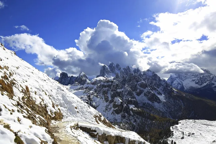 Framed Print : View of the Three Peaks with clouds and mountain trail in the foreground under bright sun