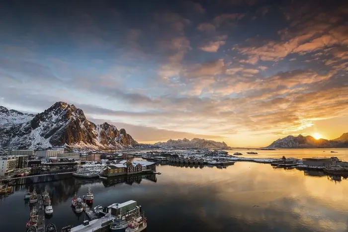 Framed Print : View over the port of Svolvaer on the Lofoten islands in colorful early morning sunrise in winter with snow