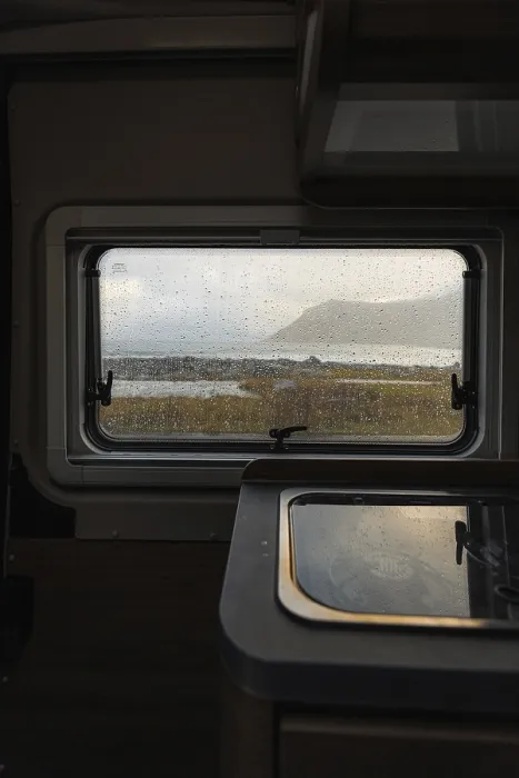 Framed Print : View from rainy campervan kitchen window on Flakstad beach