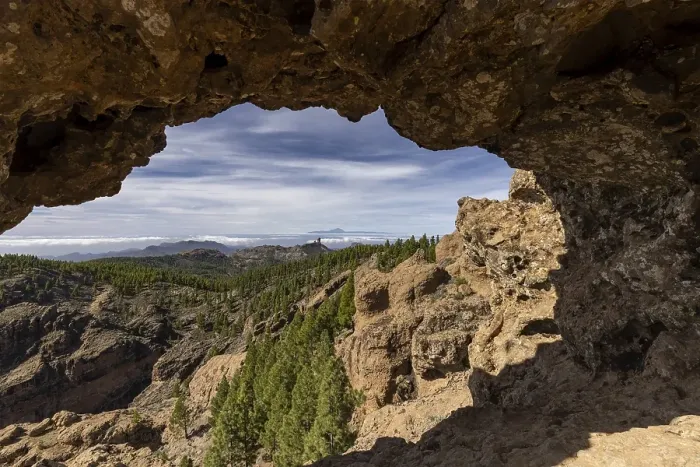 Framed Print : View through a rock arch to Roque Nublo and the Teide mountain peak on the neighbouring island of Tenerife Framed Print : View through a rock arch to Roque Nublo and the Teide mountain peak on the neighbouring island of Tenerife