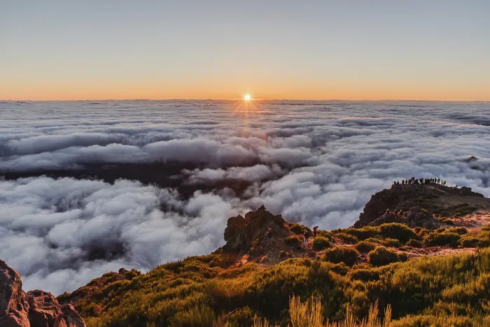 Framed Print : View over a sea of clouds at sunrise from a mountain peak with a calm and charming atmosphere Framed Print : View over a sea of clouds at sunrise from a mountain peak with a calm and charming atmosphere