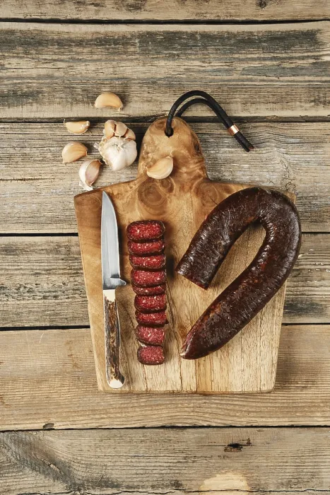 Framed Print : Top view of smoked dried beef sausage on wooden cutting board Framed Print : Top view of smoked dried beef sausage on wooden cutting board