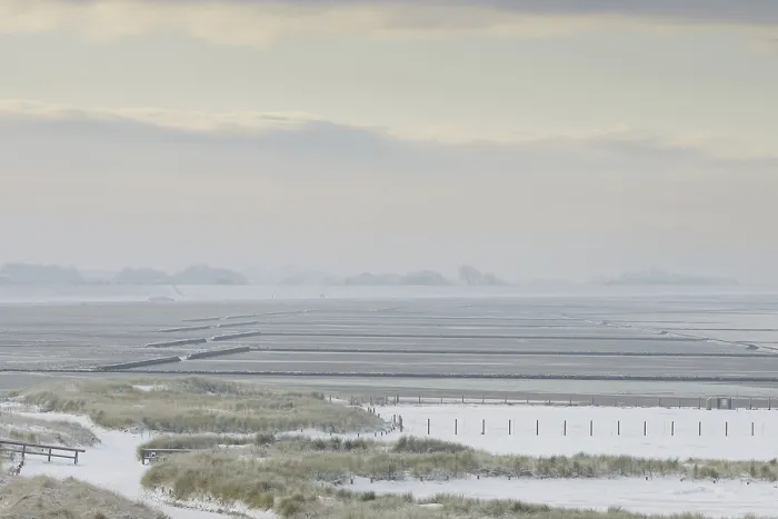 Framed Print : View over the snow-covered dune landscape of Norddeich Framed Print : View over the snow-covered dune landscape of Norddeich