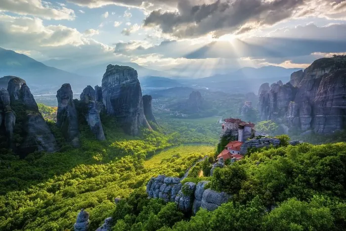 Framed Print : View with sunset with sun rays over the monastery of Rousanou and the monastery of St