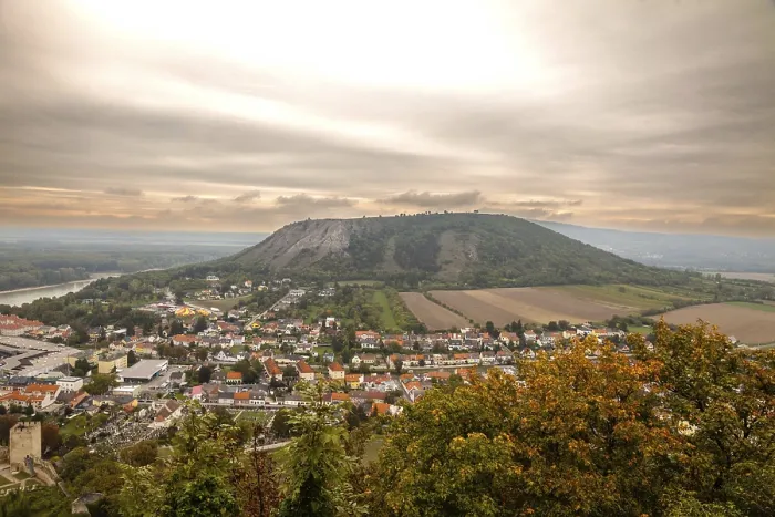 Framed Print : View of a town and a hill on the horizon under a vaste sky