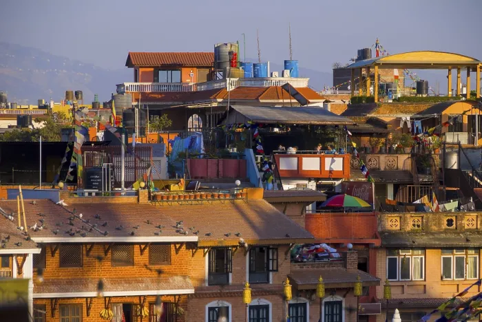 Framed Print : View of urban roofs with doves and terraces illuminated by sunlight in Nepal Framed Print : View of urban roofs with doves and terraces illuminated by sunlight in Nepal