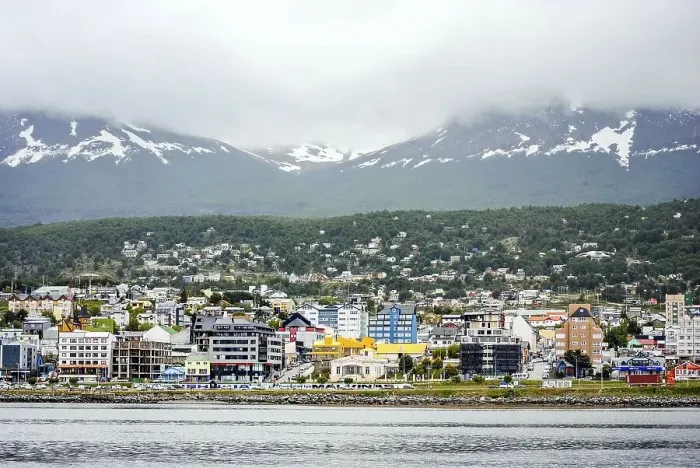 Framed Print : View of Ushuaia city on a cloudy day from the ocean