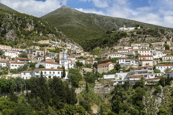 Framed Print : View of village of Dhermi, Albania whitewashed buildings on mountainside Framed Print : View of village of Dhermi, Albania whitewashed buildings on mountainside