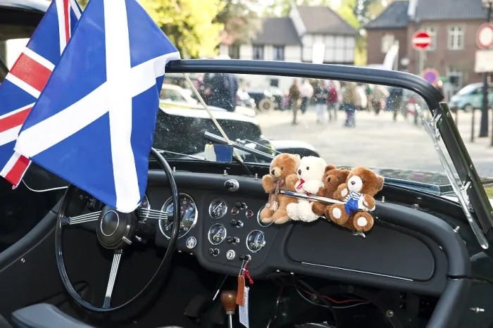 Framed Print : View through the windscreen of a classic car on a castle square