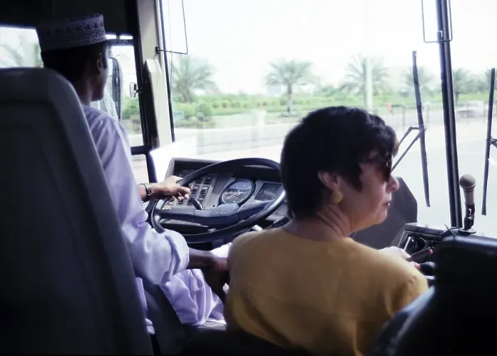 Framed Print : View through the windscreen of a coach with driver and tour guide, Muscat, Oman, Asia