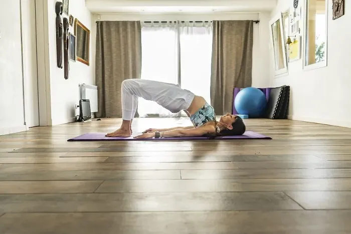 Framed Print : Side view of a woman practicing yoga