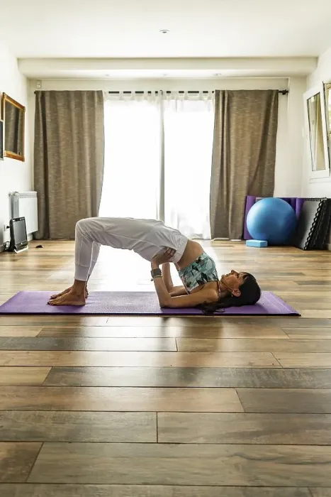 Framed Print : Side view of a woman practicing yoga
