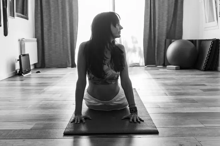 Framed Print : Front view of a woman practicing yoga