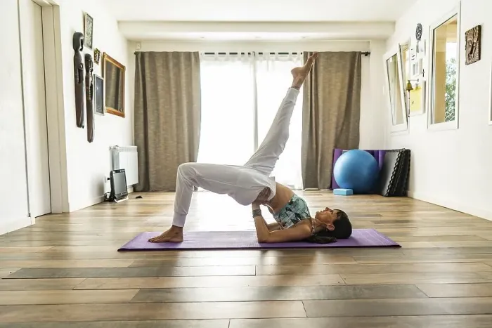 Framed Print : Side view of a woman practicing yoga