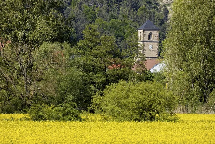 Framed Print : A village is dominated by a church tower