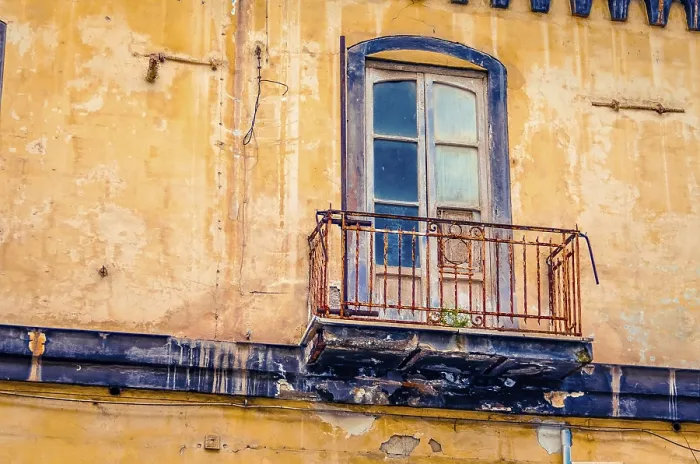 Framed Print : Vintage balcony on an old abandoned and decaying house facade in Italy Framed Print : Vintage balcony on an old abandoned and decaying house facade in Italy