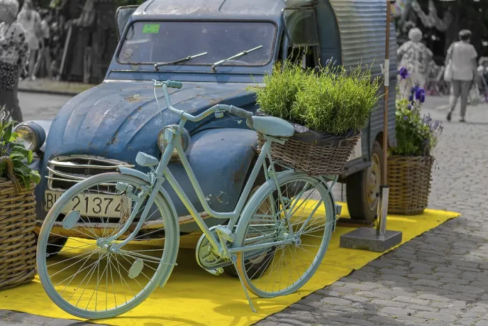 Framed Print : Vintage car, bicycle, flowers, decoration in front of castle Framed Print : Vintage car, bicycle, flowers, decoration in front of castle