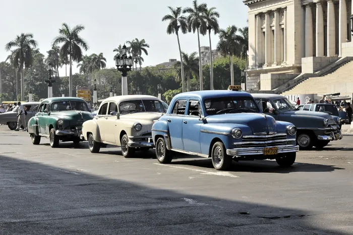 Framed Print : Vintage car driving on a street in a city with the Capitol in the background by day