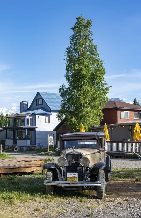 Framed Print : Vintage car and historic building