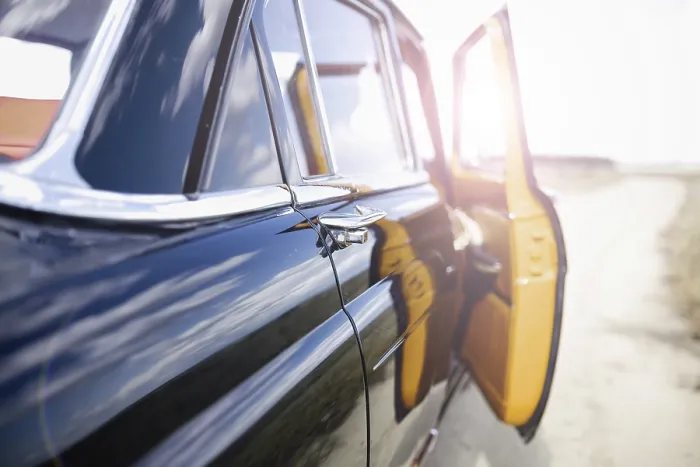 Framed Print : A vintage car with an open door on a sunlit road Framed Print : A vintage car with an open door on a sunlit road