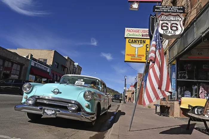 Framed Print : Vintage car parked in front of souvenir shop on Route 66