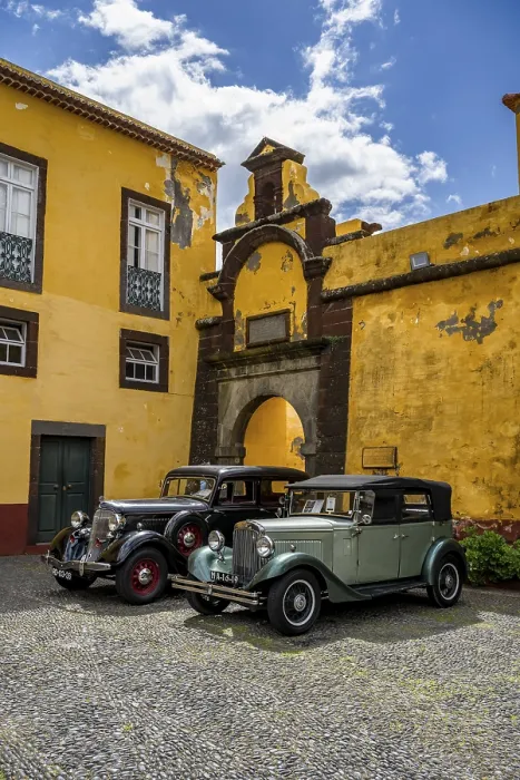 Framed Print : Vintage cars parked in front of yellow gate and wall Framed Print : Vintage cars parked in front of yellow gate and wall