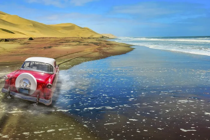 Framed Print : A vintage pink car on a sandy road with dunes and ocean background Framed Print : A vintage pink car on a sandy road with dunes and ocean background