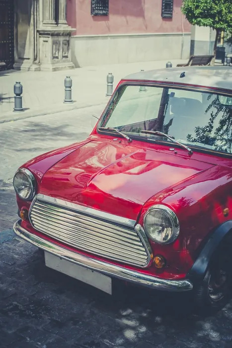Framed Print : Vintage small red car on the street Framed Print : Vintage small red car on the street