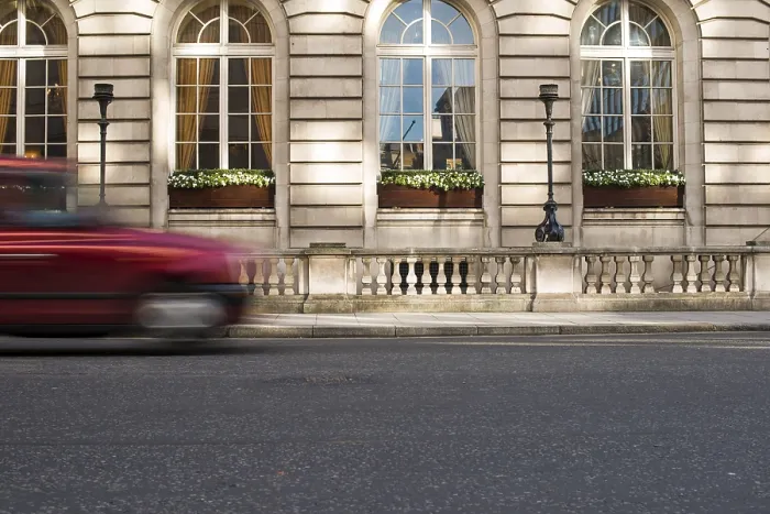 Framed Print : Vintage Taxi in motion in London